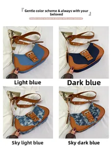 Close-up of four patchwork denim hobo bags with brown leather straps and metal buckles