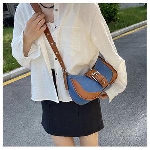 Retro denim and brown leather saddle bag with adjustable eyelet shoulder strap