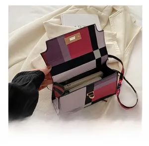 Internal view of the colorful plaid square bag showing phone storage capacity