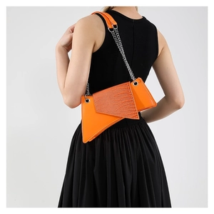 Asymmetric orange crocodile pattern shoulder bag with silver chain strap for women