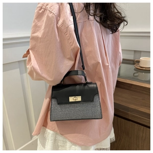 Contrast color square handbag with glitter panel and golden metallic turn-lock closure
