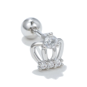 Detailed macro view of crown-shaped stud earring with silver metal and clear crystals