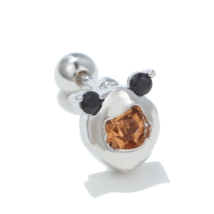 Macro view of 18k silver steel mini bear stud with orange stone and ball screw back