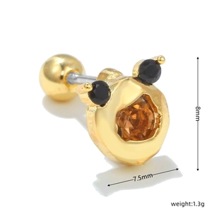 Detailed view of 18k gold bear ear stud with amber stone and size measurements