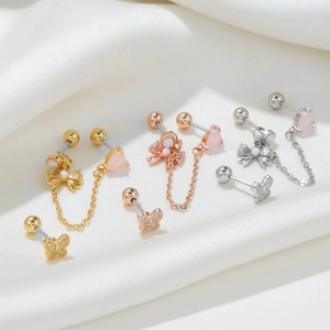 Boucles d'oreilles cœur rose en zircon avec pompons et nœud papillon en divers métaux