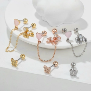 Boucles d'oreilles cœur rose et nœud avec glands et perles en finition or et argent