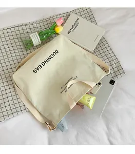 Macro view of canvas tote bag interior showing large capacity for daily essentials
