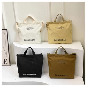 Large canvas tote bag set in four colors with adjustable straps and retro design