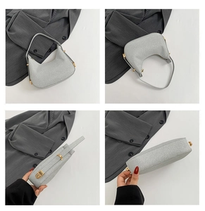 Detail view of a silver sequin hobo bag showing its crescent shape and zip closure