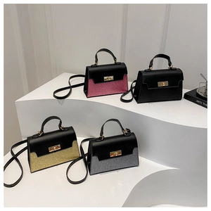 Contrast panel trapezoid handbags with glitter finish and metallic turn-lock closure