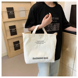 Large capacity off-white canvas tote bag with adjustable shoulder strap and print