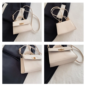 Detailed views of a cream PU leather trapezoid handbag with gold rotating lock and strap