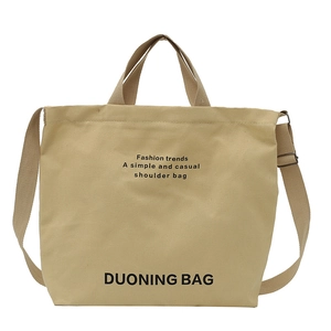 Minimalist beige canvas tote bag with adjustable shoulder strap and large capacity