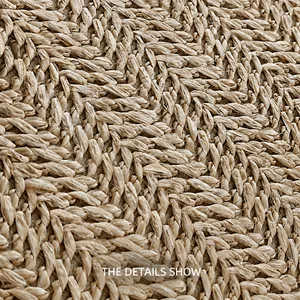 Close-up of high-quality woven straw fabric featuring a tight herringbone twill pattern