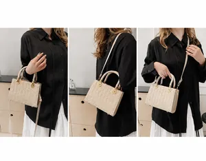 Three-way carry cream straw tote bag showing handheld, shoulder and crossbody styles