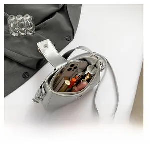 Top view of silver moon bag showing internal capacity for phone and cosmetics