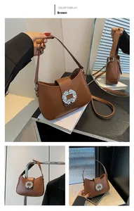Detailed view of brown leather bag featuring a sparkling square diamond buckle for women