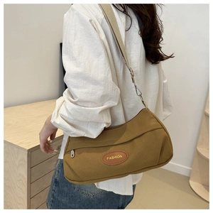 Khaki canvas crossbody bag with adjustable wide strap and brown leather FASHION patch