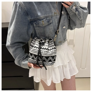 Ethnic bucket bag with black and white tribal geometric patterns and drawstring closure