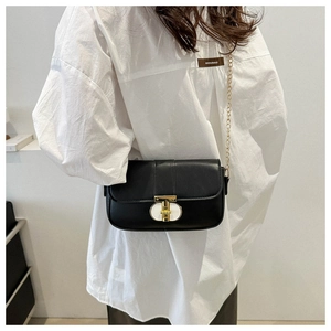 Fashionable black leather chain crossbody bag with gold hardware and flap closure