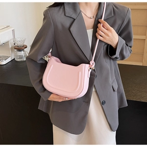 Pink minimalist saddle crossbody bag for women with decorative embossed U-shaped lines