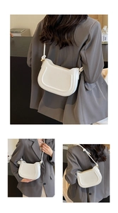 Detailed multi-angle views of white saddle bag with U-shaped stitching and adjustable strap