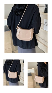 Detailed views of a nude leather saddle bag with U-shaped stitching and slim shoulder strap