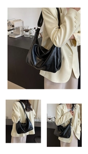 Detail of black leather tote bag with geometric stitching and wide shoulder strap