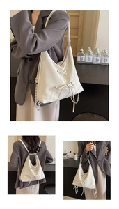 White multi-use backpack featuring decorative lacing, bow details and a slim chain strap
