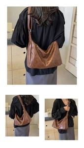 Detail of a brown patchwork leather hobo bag featuring adjustable wide shoulder straps