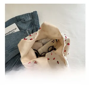 Detail view of large corduroy tote bag showing spacious interior with daily essentials