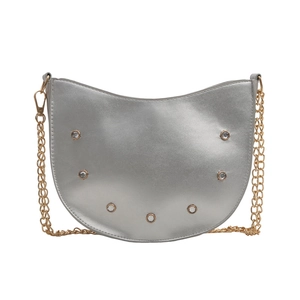 Sleek silver crescent shoulder bag with rhinestone accents and gold chain strap