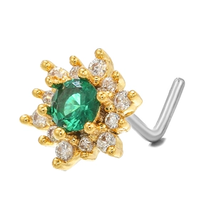 Macro detail of L-shaped nose stud with emerald green stone and zircon flower cluster