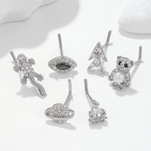 L-shaped surgical steel nose stud set featuring animal and geometric zircon designs