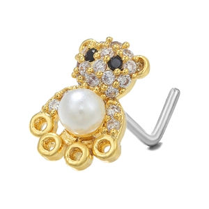 Macro detail of gold bear nose stud with sparkling zircon pavé and pearl belly accent