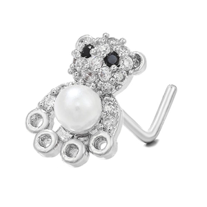 Close-up of L-shaped nose stud featuring a bear design with zircons and a white pearl