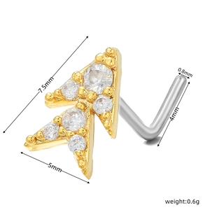 Detailed view of L-shaped gold arrow nose stud with micro-pave cubic zirconia stones