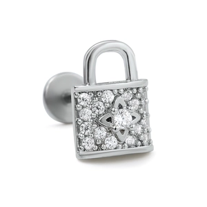 Detailed view of padlock earring with pave-set zircons and starburst center detail