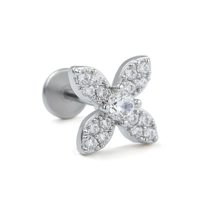 Macro detail of silver floral labret stud with crystal zircon and flat back screw design