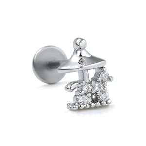 Close-up of mushroom house stud with micro-set zircons on polished stainless steel