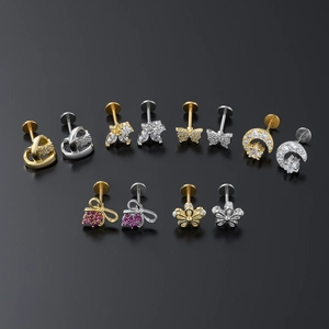 12-piece set of geometric labret studs with butterfly and flower crystal designs