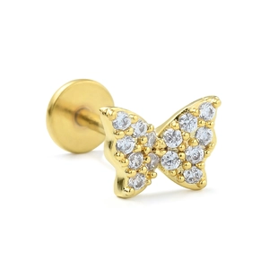 Macro detail of a gold butterfly labret stud with white pavé cubic zirconia stones