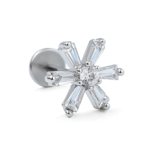 Macro view of snowflake labret stud with baguette-cut zircons in claw setting