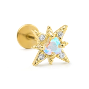 Detailed view of golden starburst labret with heart-shaped opal and cz zirconias