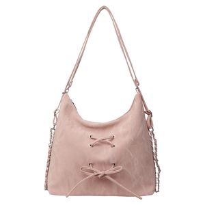 Pink faux leather hobo bag with drawstring bow and chain strap on white background