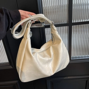 Chic cream white oversized PU leather tote bag with quilted stitching and wide strap