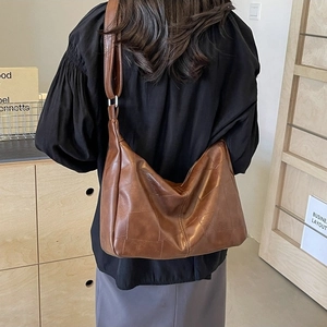 Brown vintage patchwork leather tote bag with a high-shine finish and large capacity