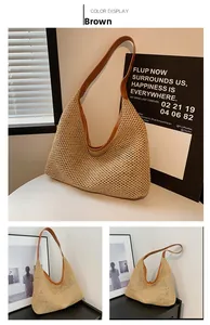 Detail view of large woven straw hobo tote bag with brown leather straps and artistic backdrop