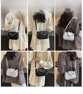 Fashion heart-flap crossbody bag with elegant pearl handle and sleek leather finish