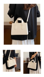 Détails d'un sac à main carré blanc minimaliste avec garnitures dorées et poignée